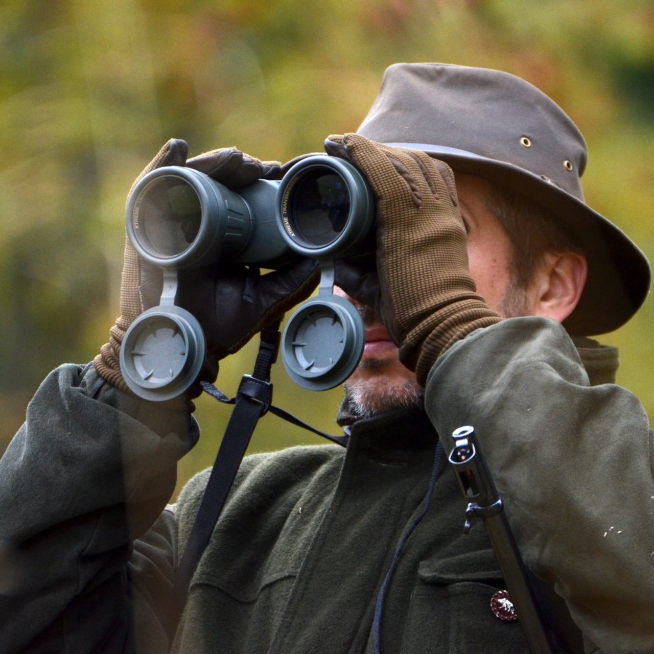 hunter looking through binoculars